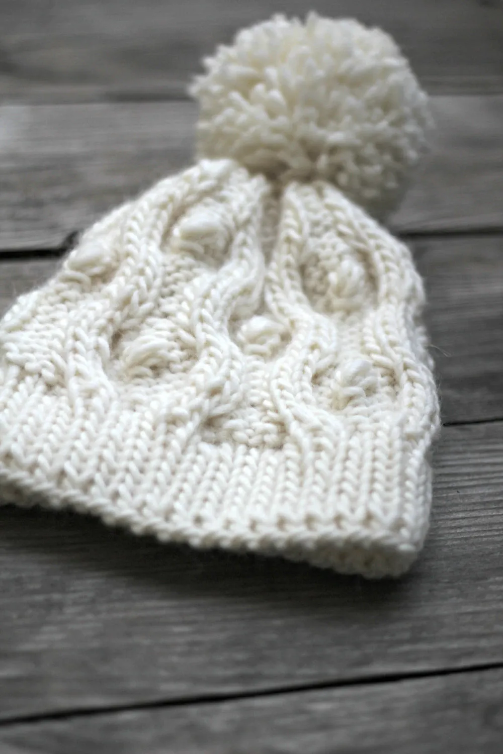 Knit beanie hat in white cream color with pom pom, winter accessories