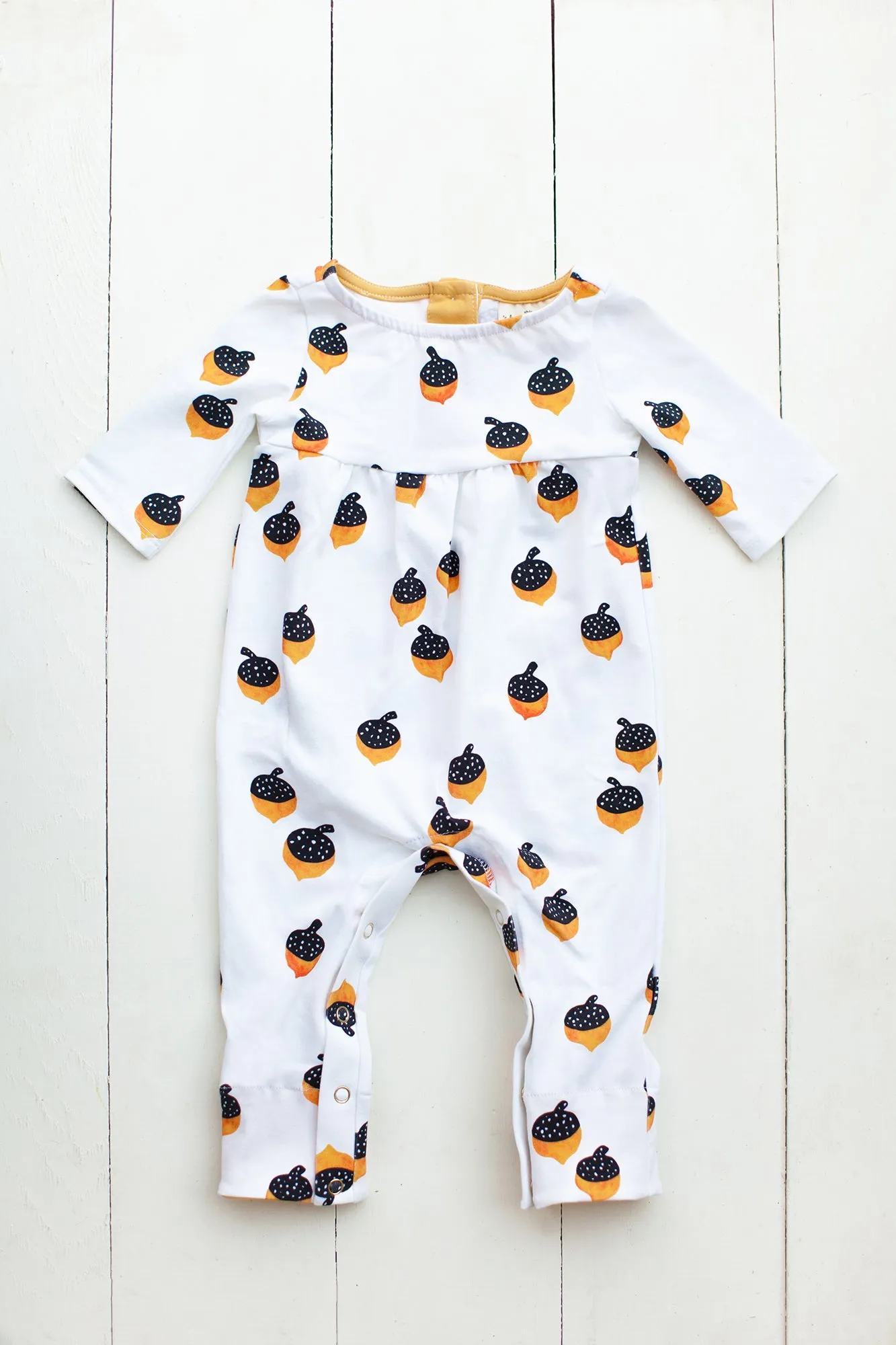 Romper in golden acorns